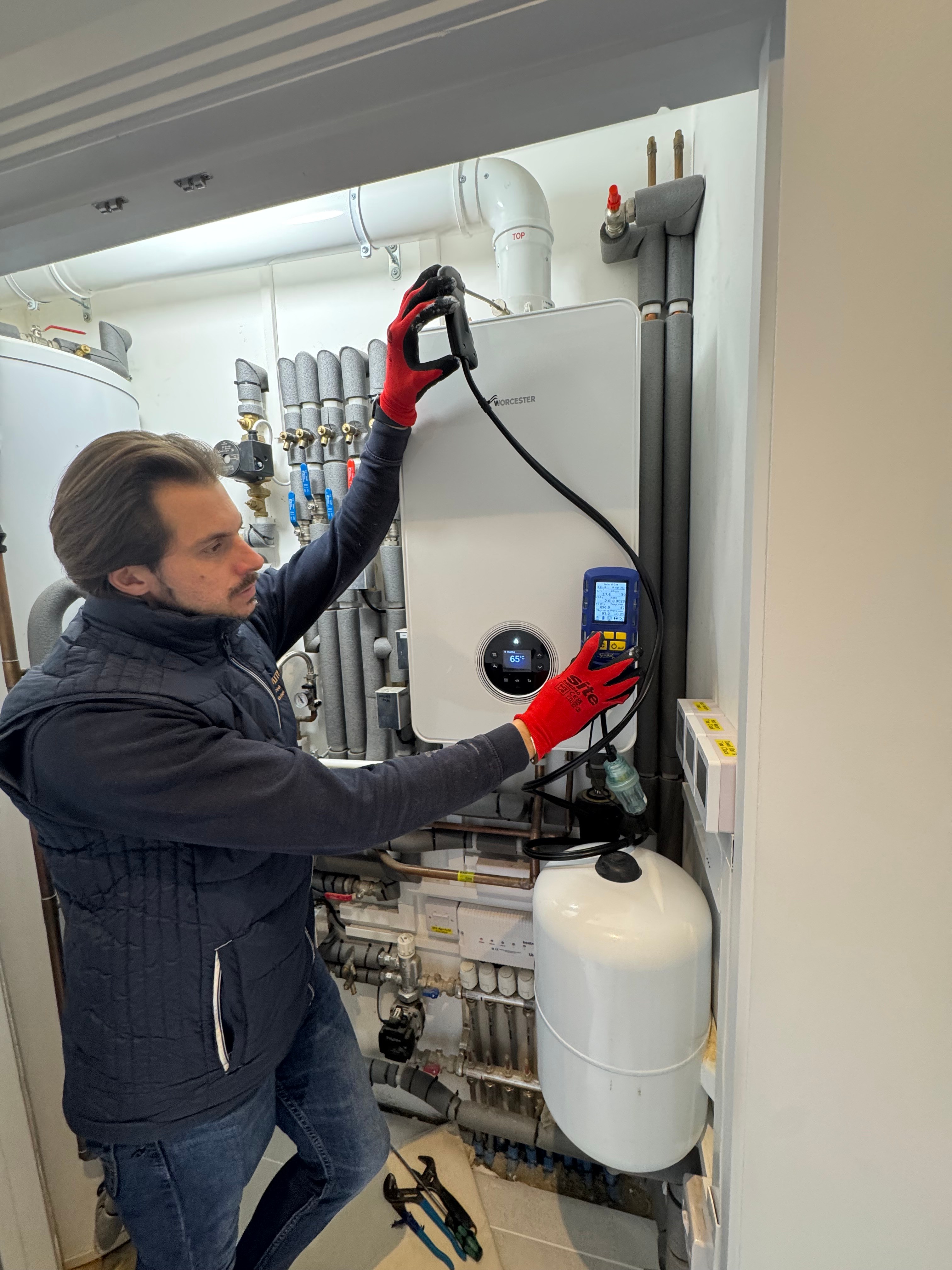 Shoosmith engineer carrying out a safety check on a Worcester Bosch boiler installation
